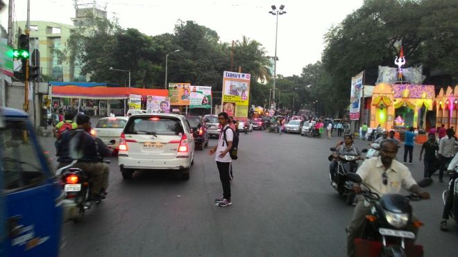 A traffic volunteer on duty during Ganeshotsav in Pune Source: Jayesh Nimase